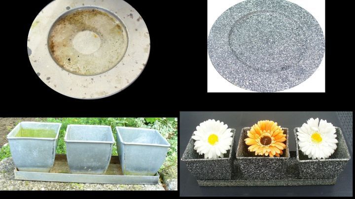 Verschiedene Granit-Effekt Produkte, darunter T&ouml;pfe und Dekorelemente, die in einem Garten-Setting pr&auml;sentiert sind.