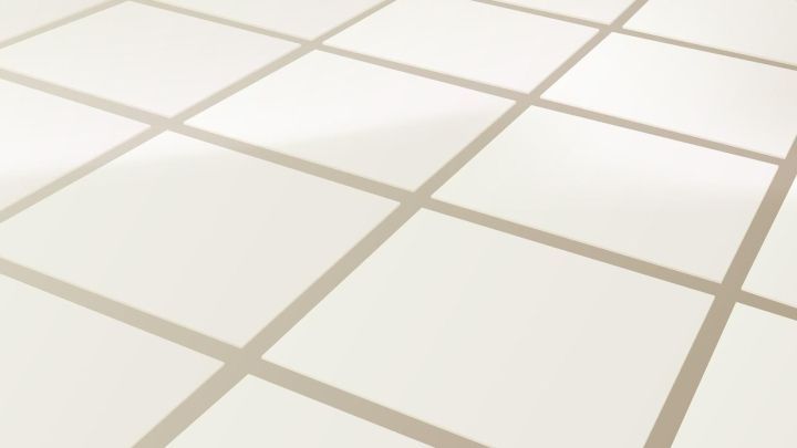 Wei&szlig;e Fliesen mit Fugen zeigen ein sauberes Umfeld; die Fugen sind sichtbar, vielleicht zum Entfernen von Katzenurin-Geruch.