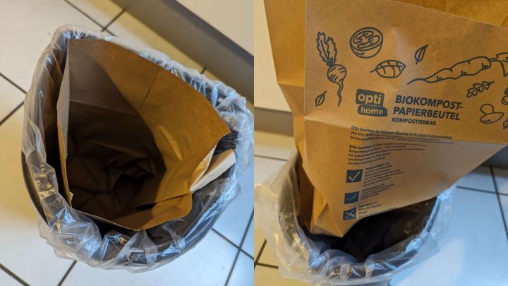 Ein Komposteimer mit einem biologisch abbaubaren Papierbeutel steht in einer K&uuml;che, bereit zur Verwendung und M&uuml;lltrennung.