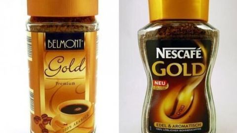 Zwei Kaffeegläser stehen nebeneinander: das eine ist "Dulce Gold" und das andere "Nescafé Gold", beide mit goldenen Deckeln.