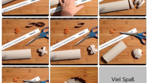 Papprolle wird mit Schere und Lineal zu Katzenspielzeug geschnitten; Text: "Viel Spaß wünsche ich Euch und Eurer Fellnase!"