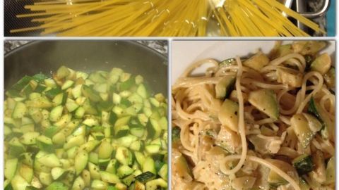 Spaghetti kochen, während Zucchini in einer Pfanne braten; serviert in einer cremigen Sauce auf einem Teller.