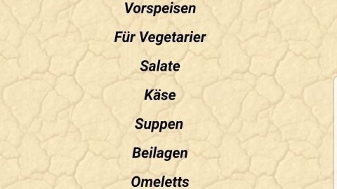 Eine Speisekarte eines Restaurants zeigt verschiedene Kategorien wie Vorspeisen, Fischgerichte und deutsche Küche.