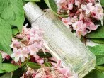 Fast leere Flasche Parfum mit Babyöl füllen