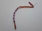 Luftballon als Gummi für Perlenarmbänder verwenden