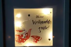 Selbst gestalteter Bilderrahmen als Mitbringsel in der Adventszeit