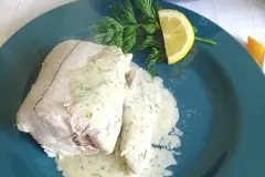 Ged&uuml;nsteter Schellfisch mit Kr&auml;uter-B&eacute;chamel