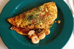 Omelett mit Garnelen und Champignons